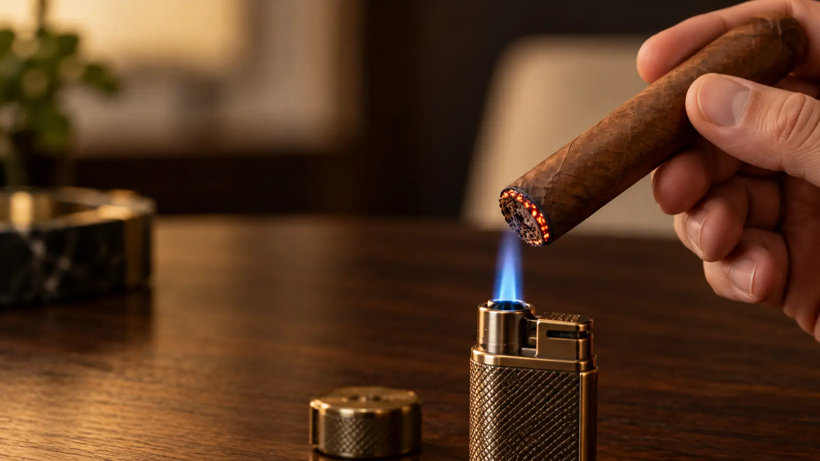 A cigar being gently toasted just above a flame